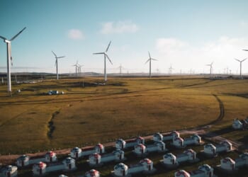 Windmills turn on Mongolian plain.
