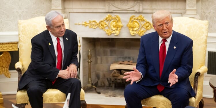 Israeli prime minister Benjamin Netanyahu confers with President Donald Trump at the White House.