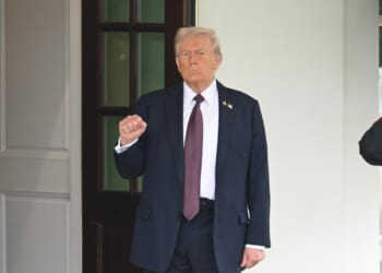 President Donald Trump appears outside of the White House.