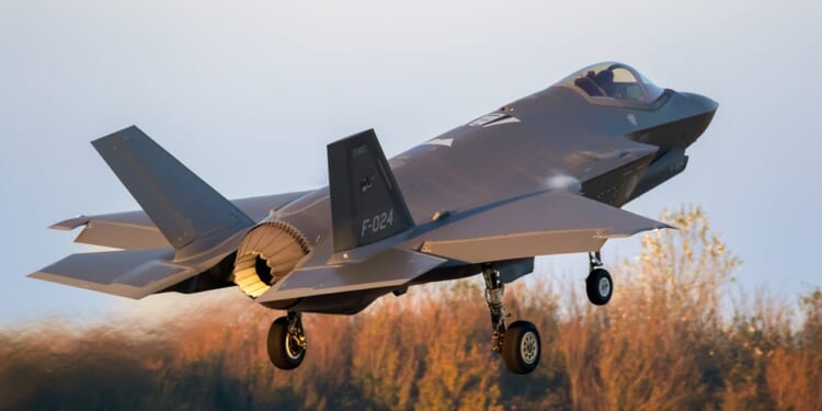 An F-35 fighter jet taking off.