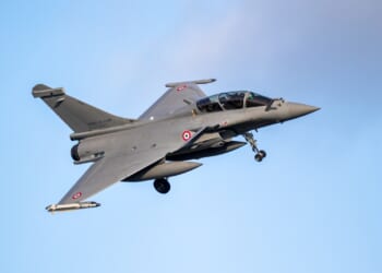 A Dassault Rafale landing at an airfield.