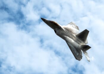 An F-22 Raptor performing an aerial maneuver.