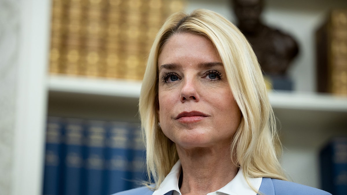 Attorney General Pam Bondi wearing blue.
