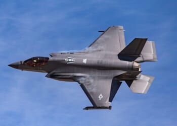 A US Air Force F-35A Lightning II creates condensation clouds shortly after takeoff.