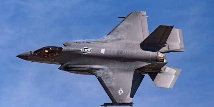 A US Air Force F-35A Lightning II creates condensation clouds shortly after takeoff.