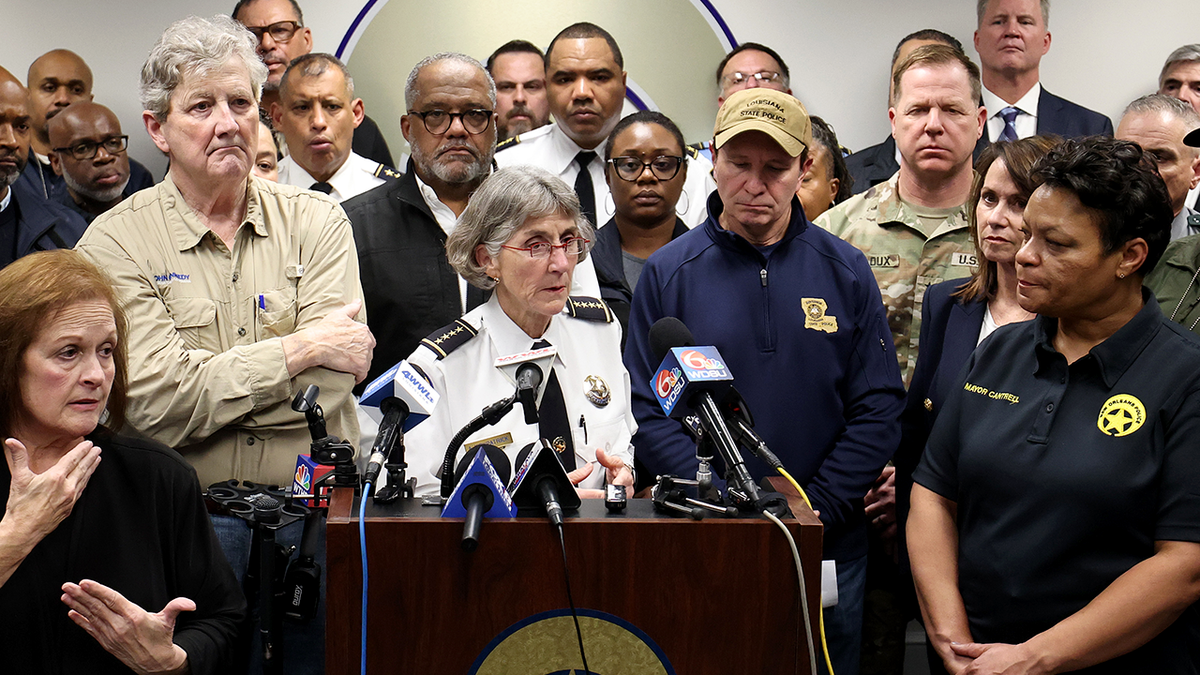 New Orleans Police Supt. Anne Kirkpatrick, center in white, is flanked by Louisiana officials after a terror attack before the 2025 Sugar Bowl.