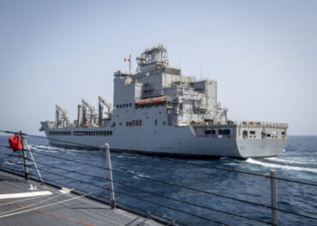 The Arleigh Burke-class guided-missile destroyer USS Lenah Sutcliffe Higbee (DDG 123) pulls alongside the John Lewis-class fleet replenishment oiler USNS John Lewis (T-AO 205) for a replenishment-at-sea in the U.S. Central Command area of responsibility.