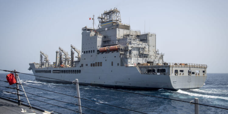 The Arleigh Burke-class guided-missile destroyer USS Lenah Sutcliffe Higbee (DDG 123) pulls alongside the John Lewis-class fleet replenishment oiler USNS John Lewis (T-AO 205) for a replenishment-at-sea in the U.S. Central Command area of responsibility.