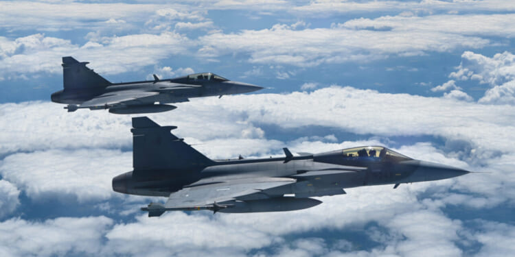 Two Saab JAS-39C Gripens, from the Czech Republic, fly alongside a B-52H Stratofortress, assigned to the 2nd Bomb Wing, Barksdale Air Force Base, Louisiana, in support of Bomber Task Force Europe 21-3, May 31, 2021.