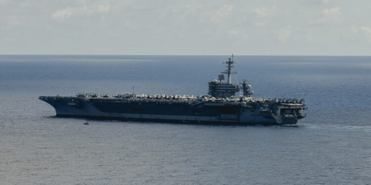 Nimitz-class aircraft carrier USS George Washington (CVN 73) steams during a search and rescue exercise while underway in the Philippine Sea, Aug. 9, 2025.