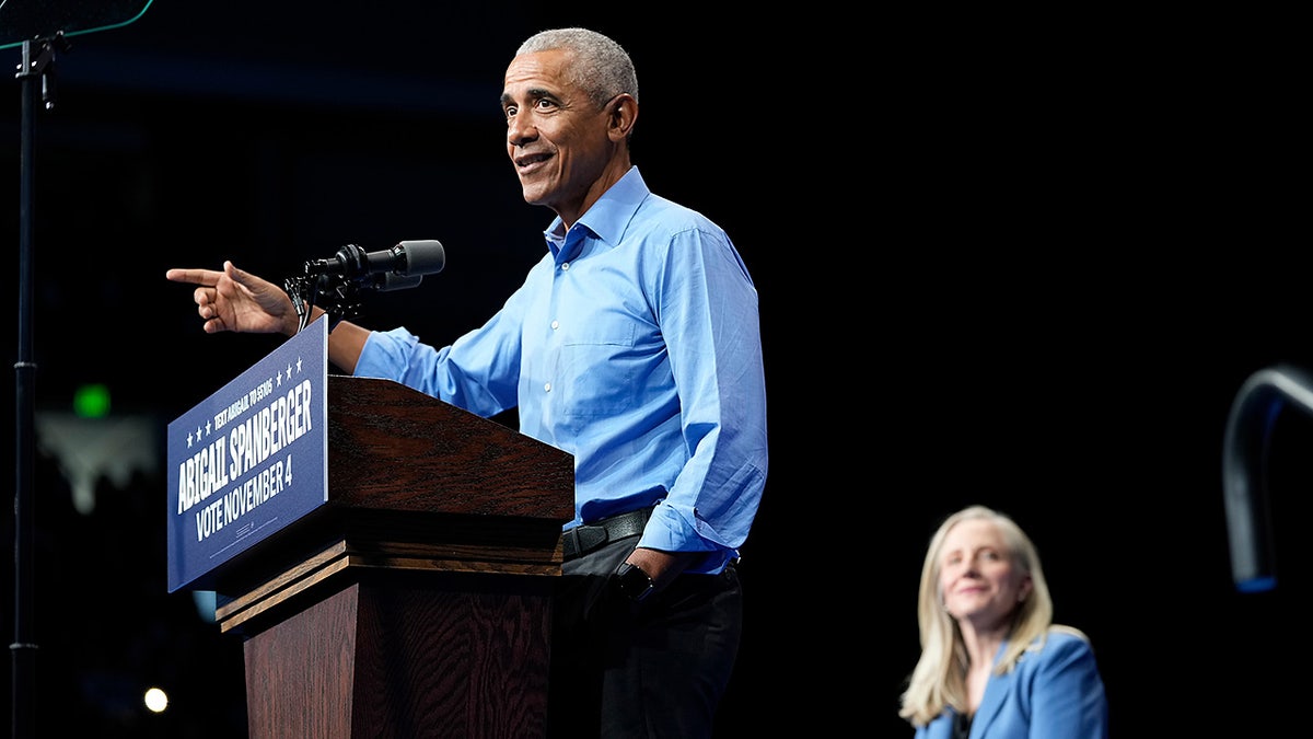 Virginia Democratic gubernatorial candidate Abigail Spanberger joins former President Barack Obama, during a campaign event Saturday, Nov. 1, 2025, in Norfolk, Va. (AP Photo/Steve Helber)