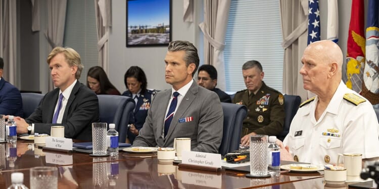 Pete Hegseth and Elbridge Colby at a meeting.