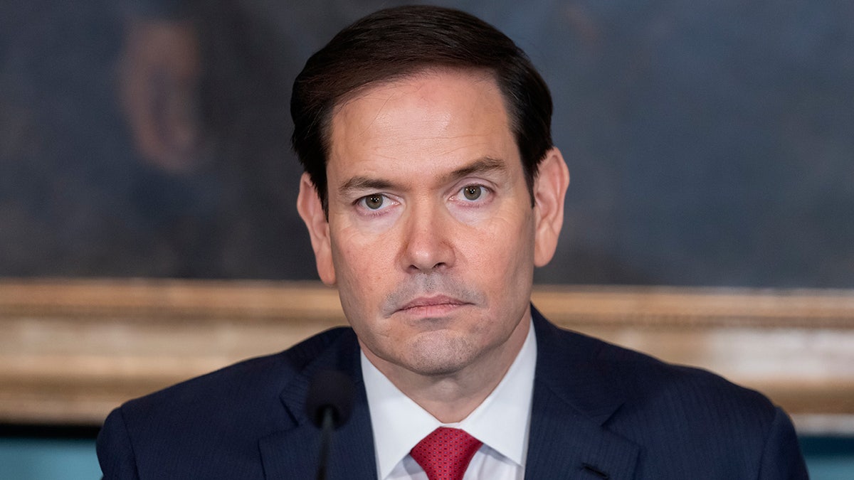 Secretary of State Marco Rubio wearing a suit and tie.