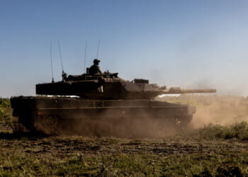 A Swedish Army Stridsvagn 122 main battle tank moves through Tofta Training Area on Swedish island Gotland during exercise BALTOPS 22.