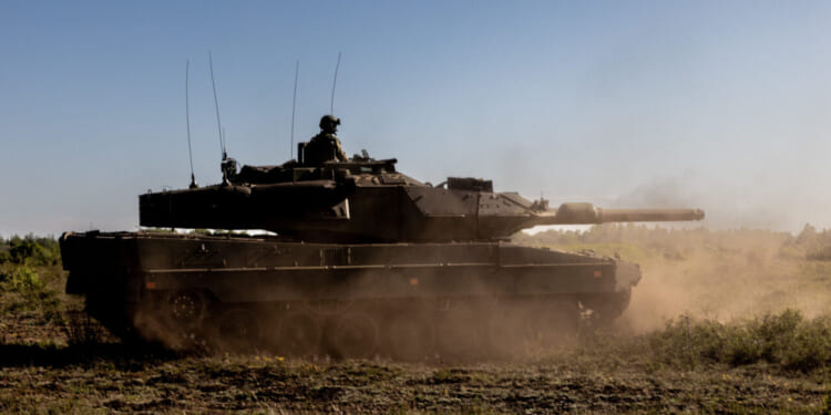 A Swedish Army Stridsvagn 122 main battle tank moves through Tofta Training Area on Swedish island Gotland during exercise BALTOPS 22.