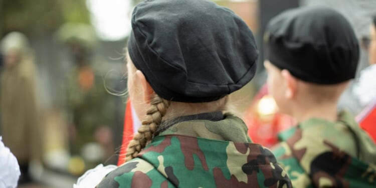 Children in military uniform in Russia.