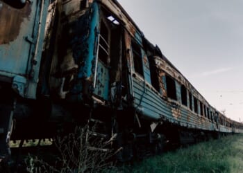Destroyed trains in a city lost in the war in Ukraine.