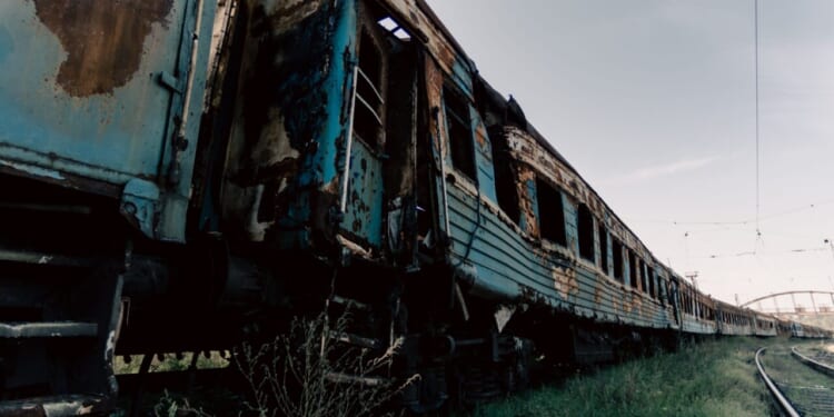 Destroyed trains in a city lost in the war in Ukraine.