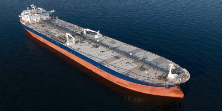 Oil Tanker in the Baltic Sea off at anchor, calm weather, drone shot. Russia energy warfare