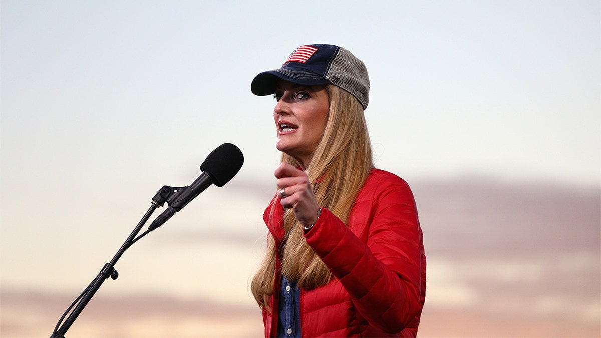 Kelly Loeffler speaking at a microphone.