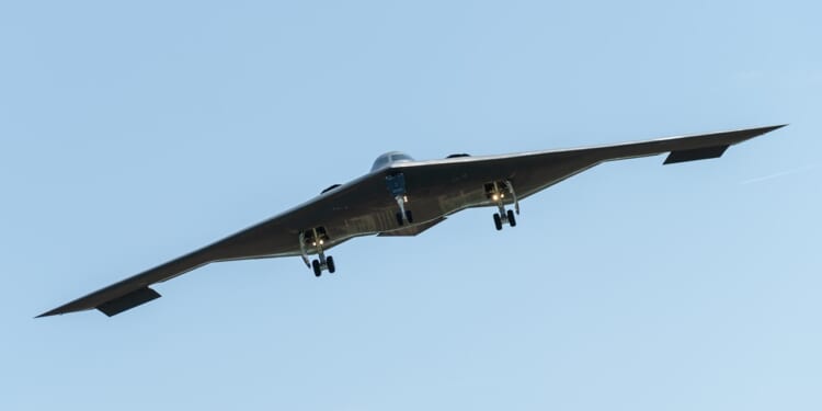 A B-2 Spirit with landing gear extended.