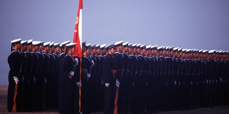 A group of Chinese sailors standing at attention.