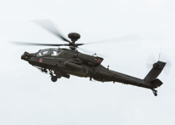 U.S. Soldiers from 12th Combat Aviation Brigade look for targets in an AH-64 Apache during the Combined Arms Training Center-led Joint Fires Observer Course (JFOC) in the Hohenfels Training Area, Germany, Aug. 21, 2025.