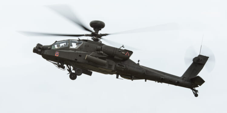 U.S. Soldiers from 12th Combat Aviation Brigade look for targets in an AH-64 Apache during the Combined Arms Training Center-led Joint Fires Observer Course (JFOC) in the Hohenfels Training Area, Germany, Aug. 21, 2025.
