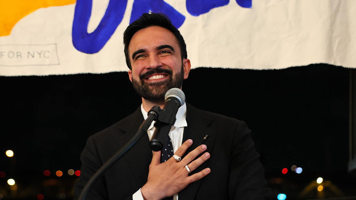 zohran mamdani speaking with his hand over his heart