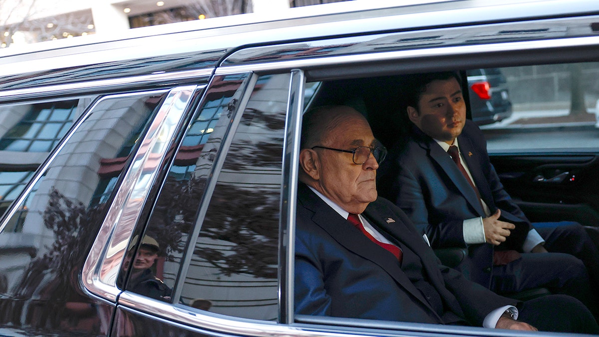 Rudy Giuliani in a car