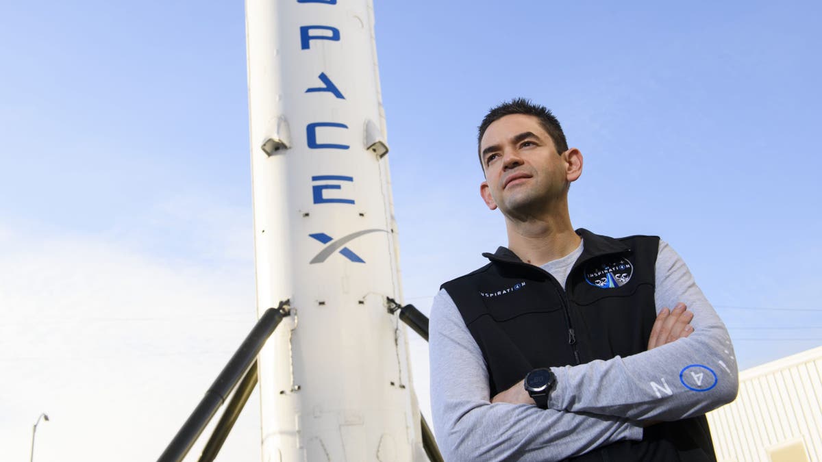 Inspiration4 mission commander Jared Isaacman, founder and chief executive officer of Shift4 Payments, stands for a portrait in front of the recovered first stage of a Falcon 9 rocket at Space Exploration Technologies Corp. (SpaceX) on February 2, 2021 in Hawthorne, California.