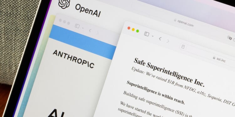 Homepages of OpenAI, Anthropic, and OpenAI co-founder Sutskever's new safety-focused AI startup Safe Superintelligence are seen on a computer. OpenAI shakeup concept.
