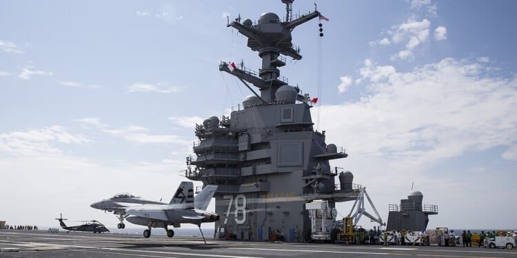 A fighter jet landing on the USS Gerald R. Ford.