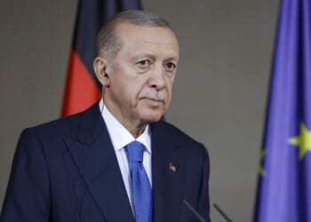 Turkish president Recep Erdogan appears at conference in Berlin.