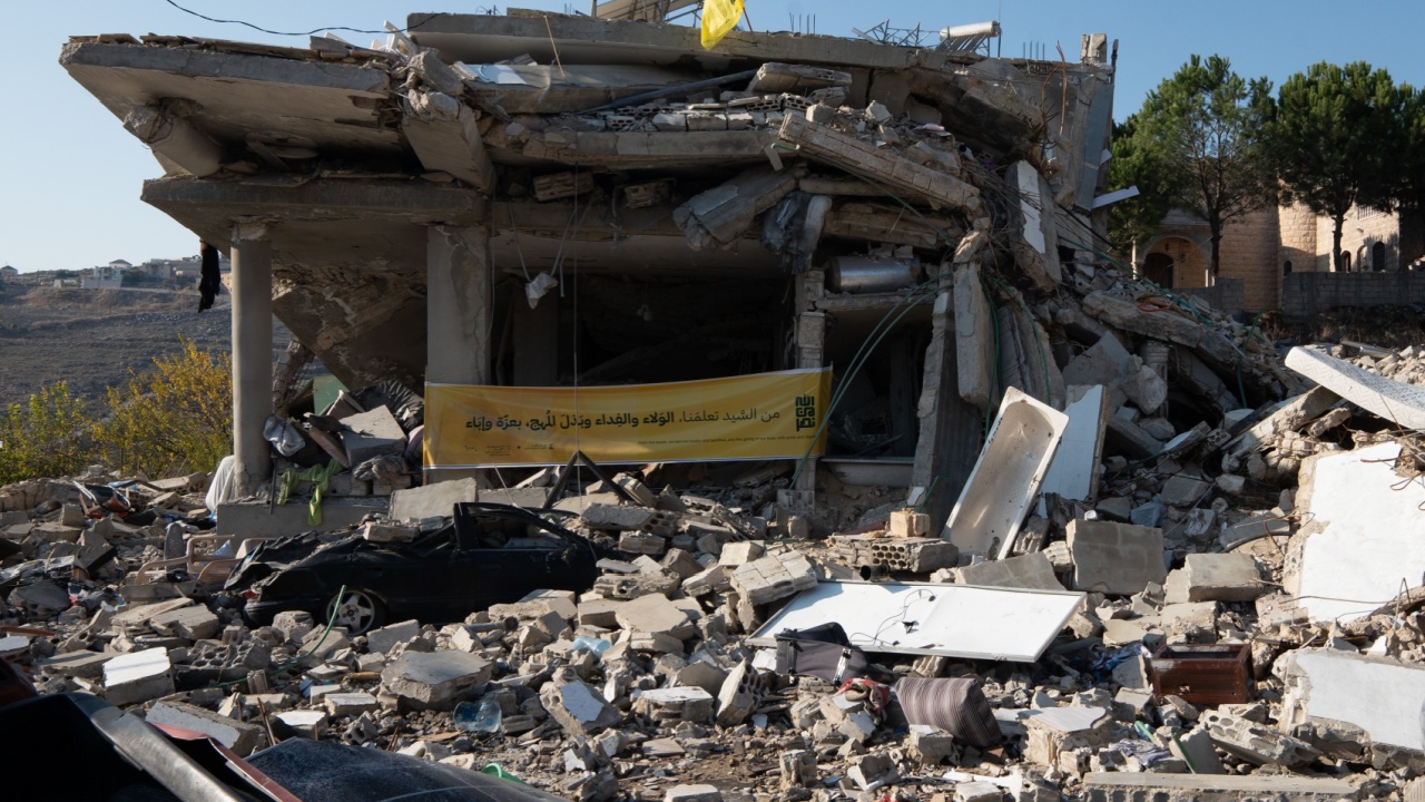 Ruin of a house in Lebanon with Hezbollah flag.