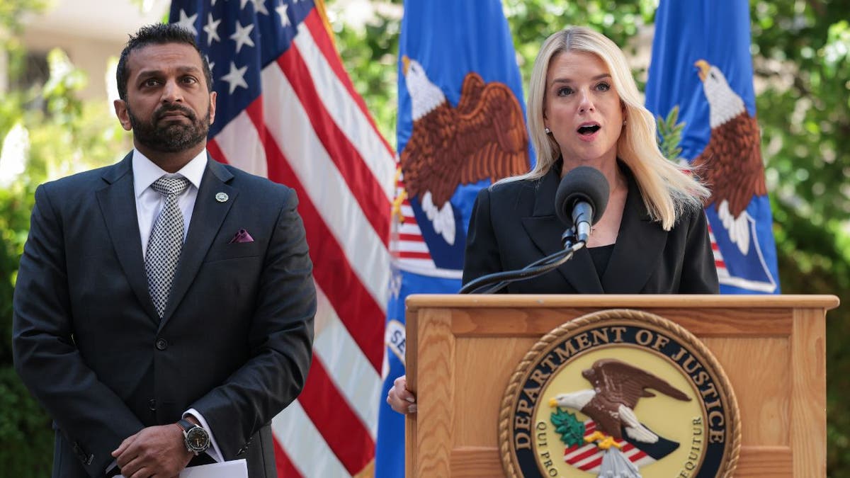 Attorney General Pam Bondi and FBI Director Kash Patel are seen at a press conference.