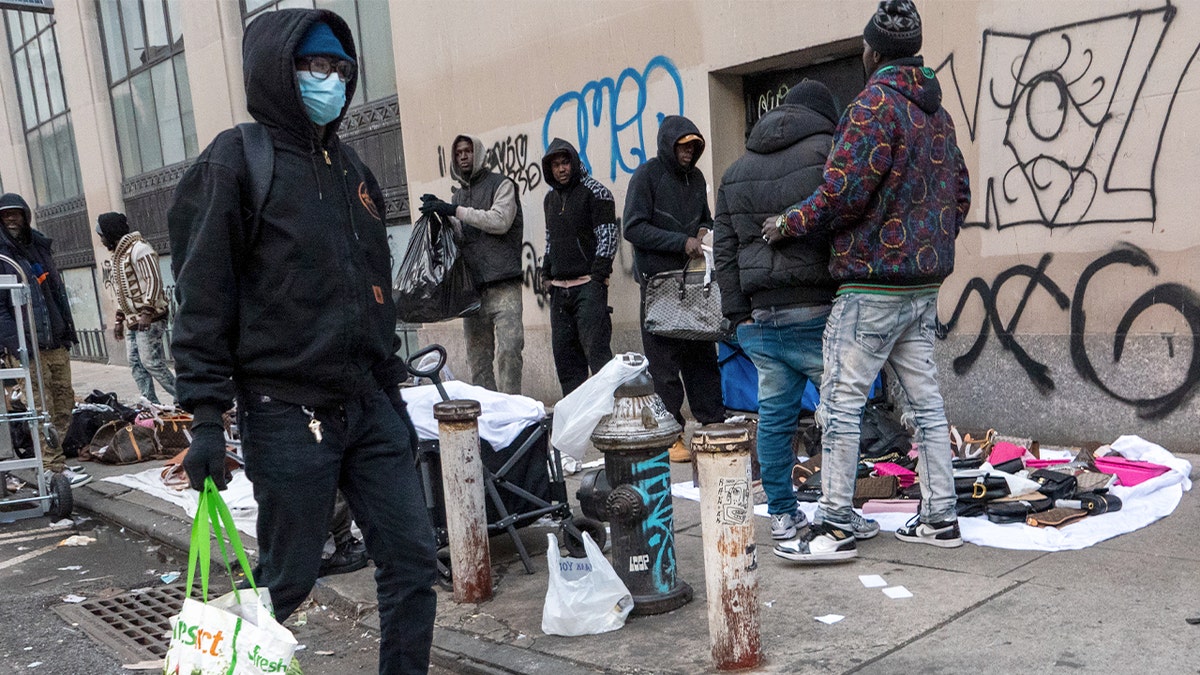 People stand on a street in New York City