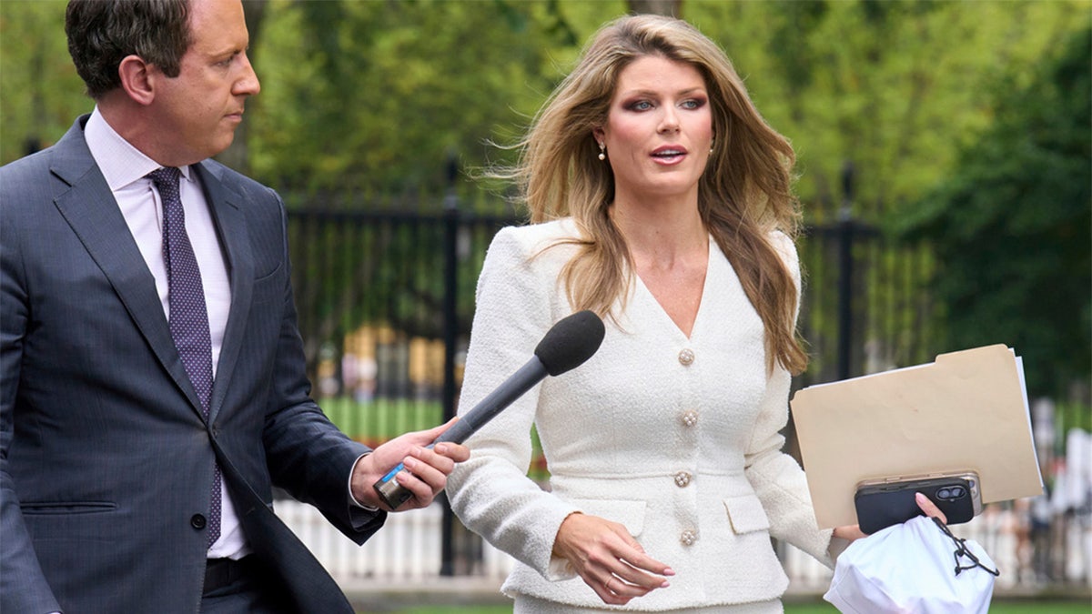 Special assistant to the president Lindsey Halligan wearing white.