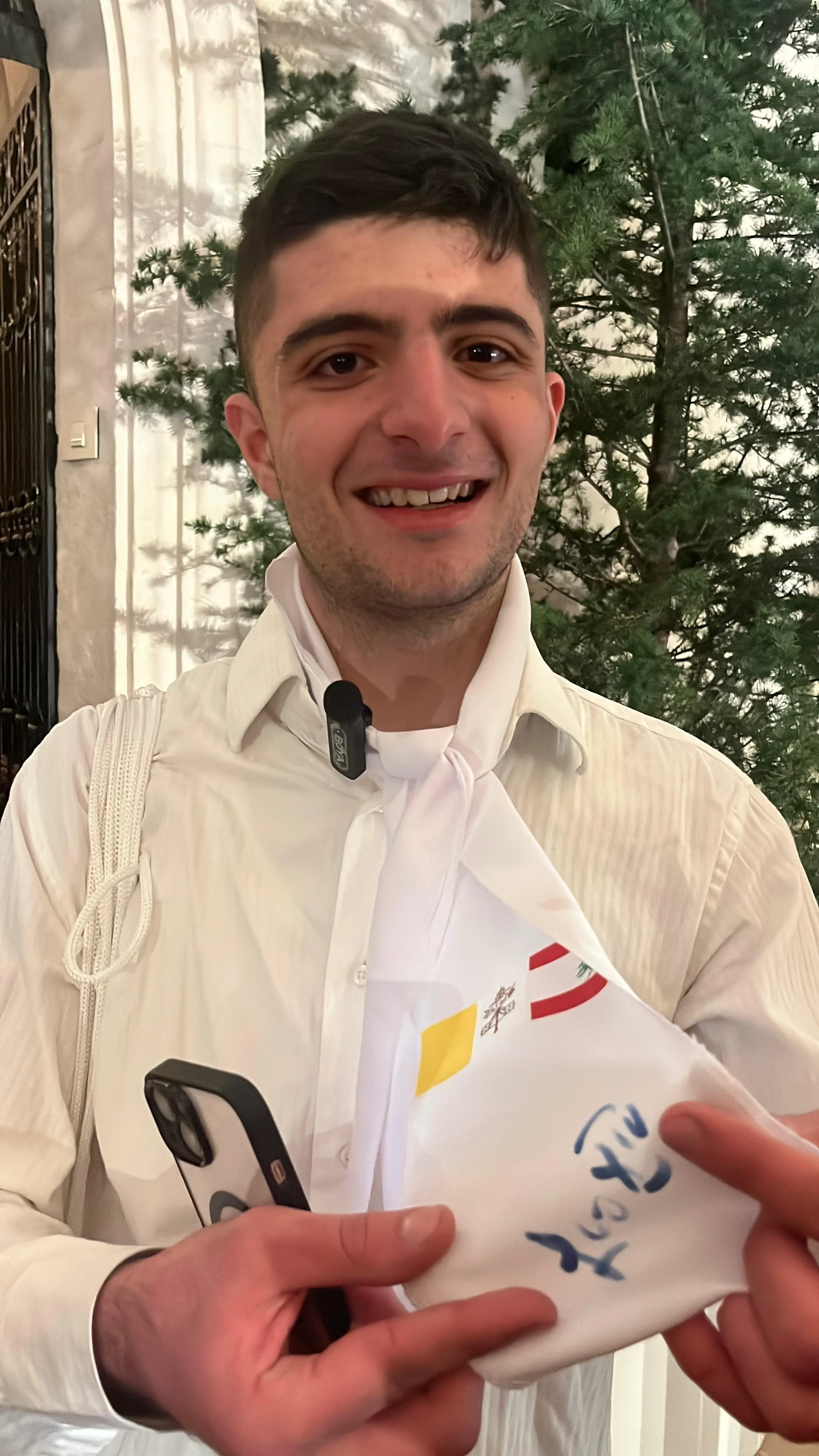 A young man named Karim said he had a deep desire to get close to the pope and receive his blessing during Pope Leo XIV’s visit to Lebanon from Nov. 30 to Dec. 2, 2025. Karim explained that he even handed the pope his scarf so that he could sign it — a moment he described as unforgettable. Credit: Romy Haber/ACI MENA