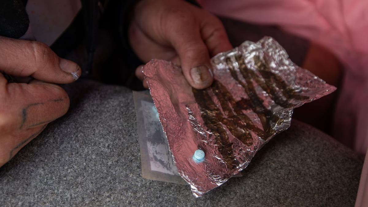 Man with fentanyl pill.