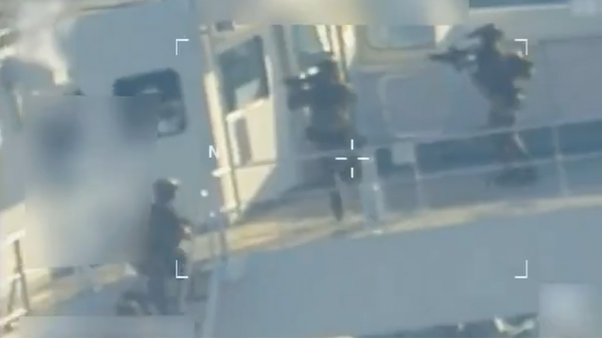 U.S. forces were seen entering the vessel with guns drawn.