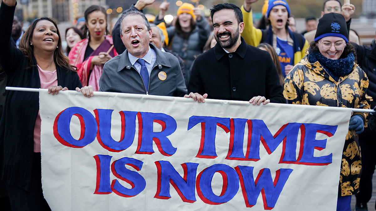 Brad Lander and Zohran Mamdani walk across the Brooklyn Bridge