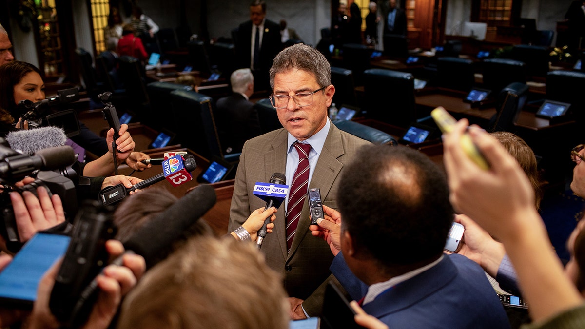 State Senator Rodric Bray answers reporter questions