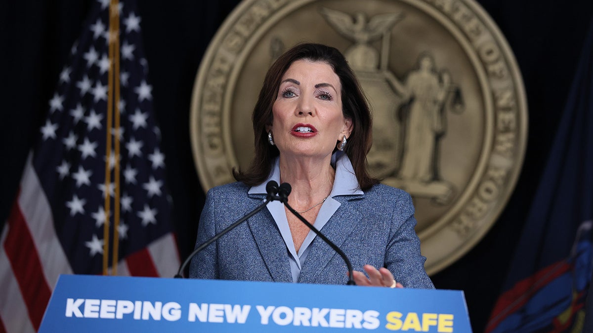 New York Gov. Kathy Hochul speaks from a podium.