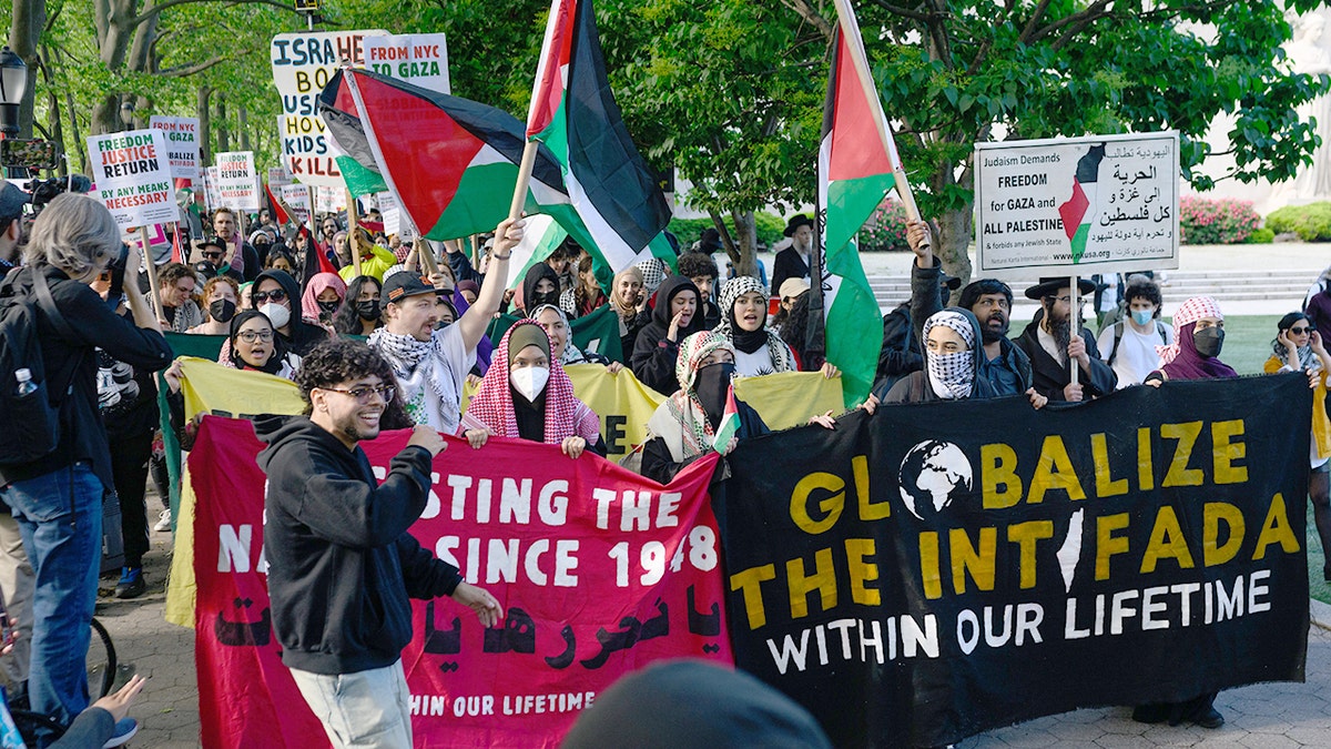 Pro-Palestinian activists hold banners in new york city