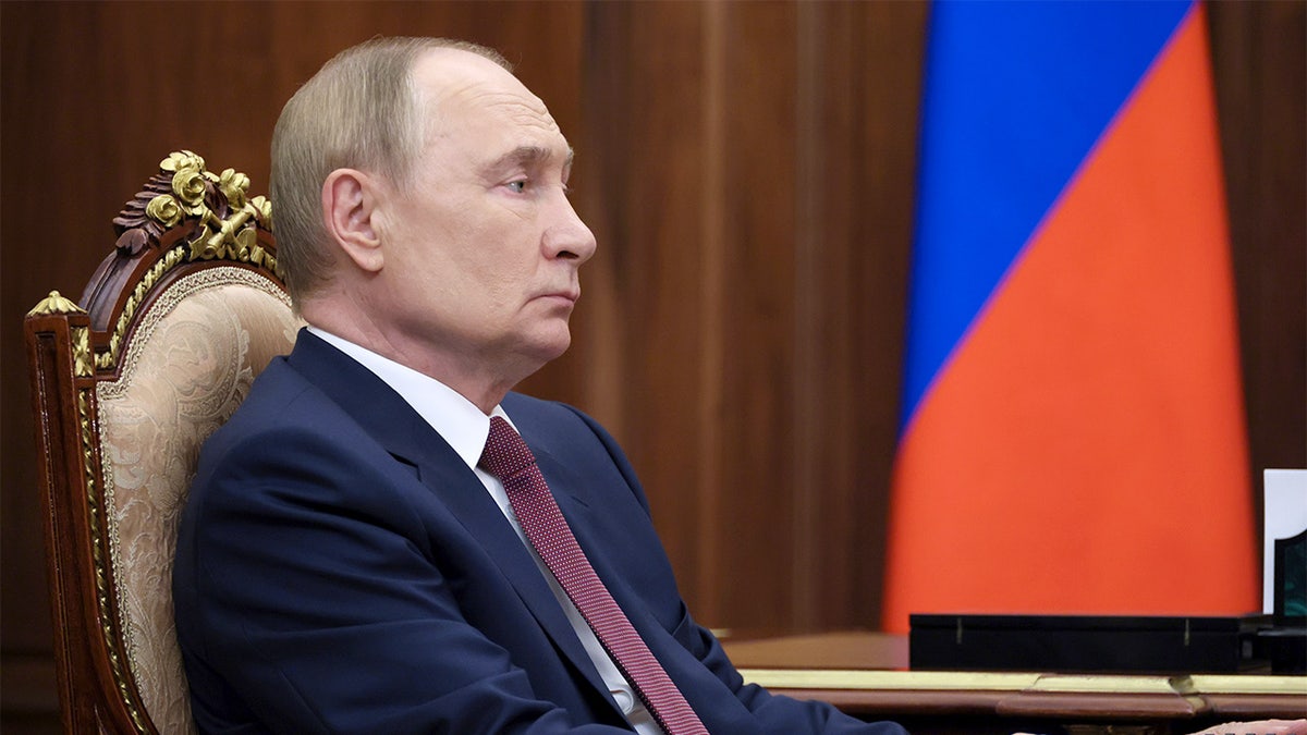 Russian President Vladimir Putin attends a meeting at the Kremlin.