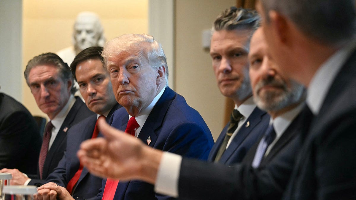 Trump listens during Cabinet meeting