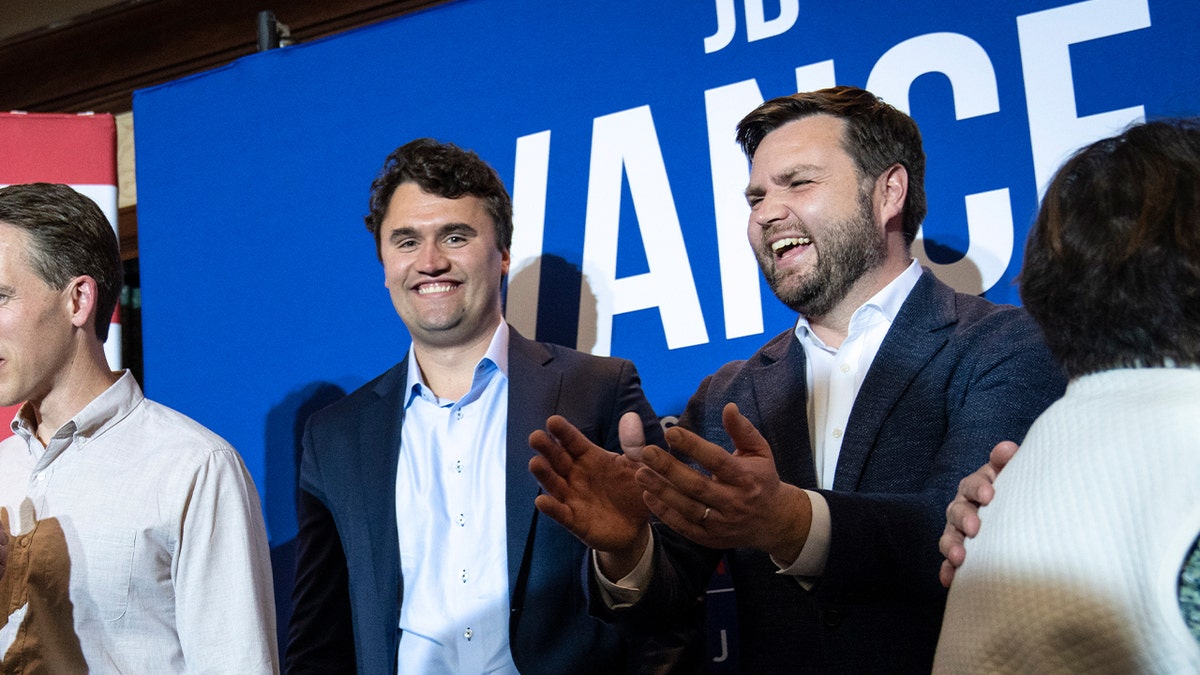 Charlie Kirk and JD Vance smiling during campaign
