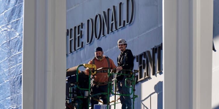 Trump's name added to Kennedy Center after board renames DC venue