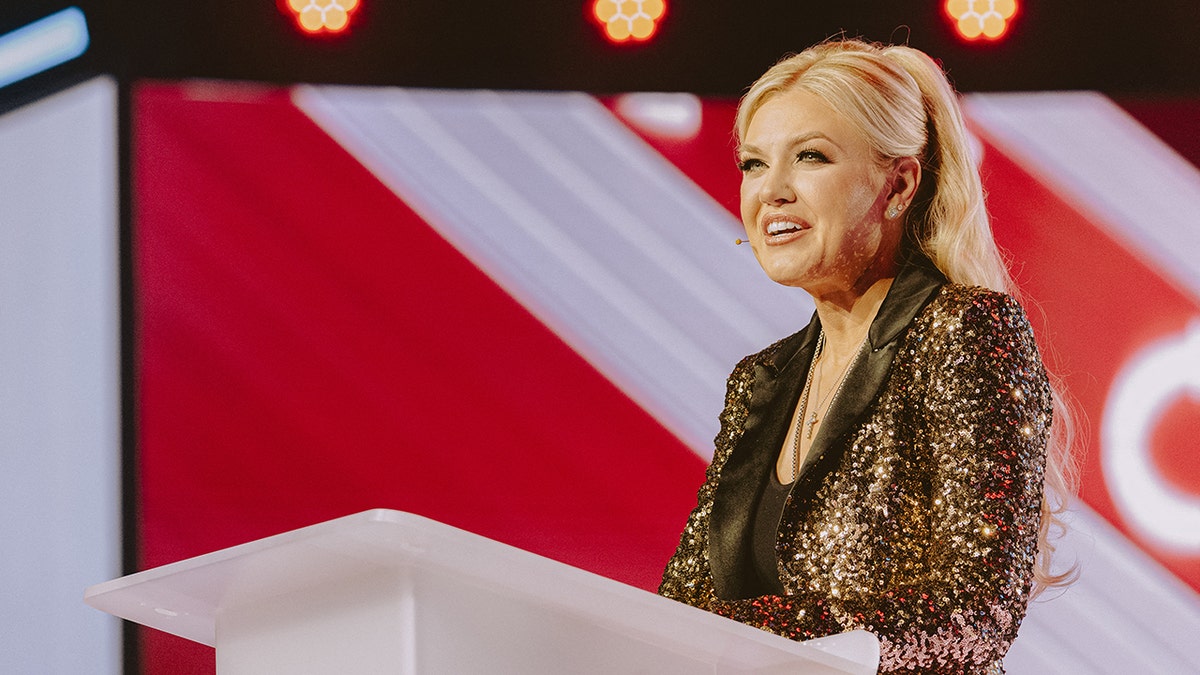 Erika Kirk speaking at AMFest